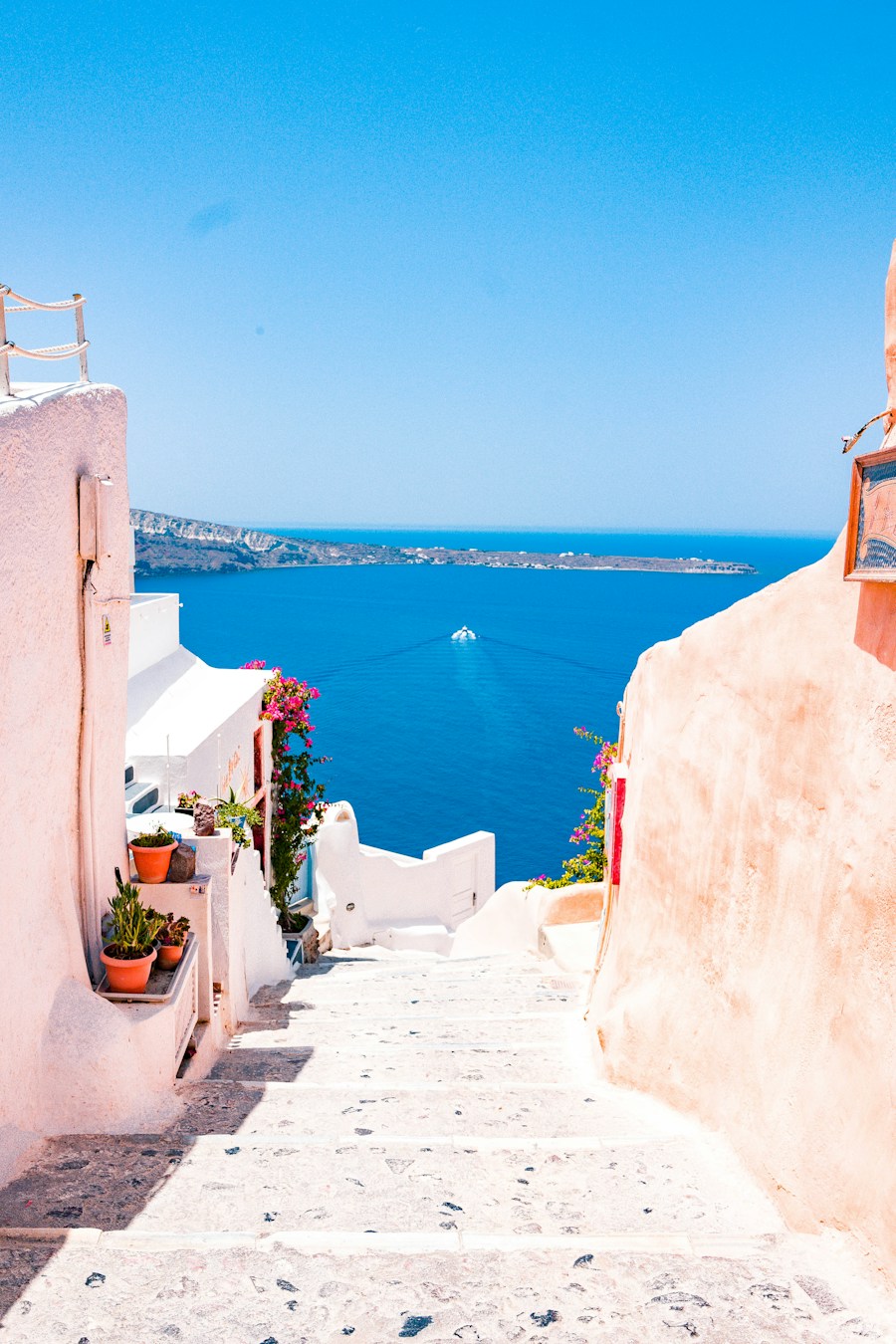 Whitewashed Greek island buildings overlooking the blue sea
